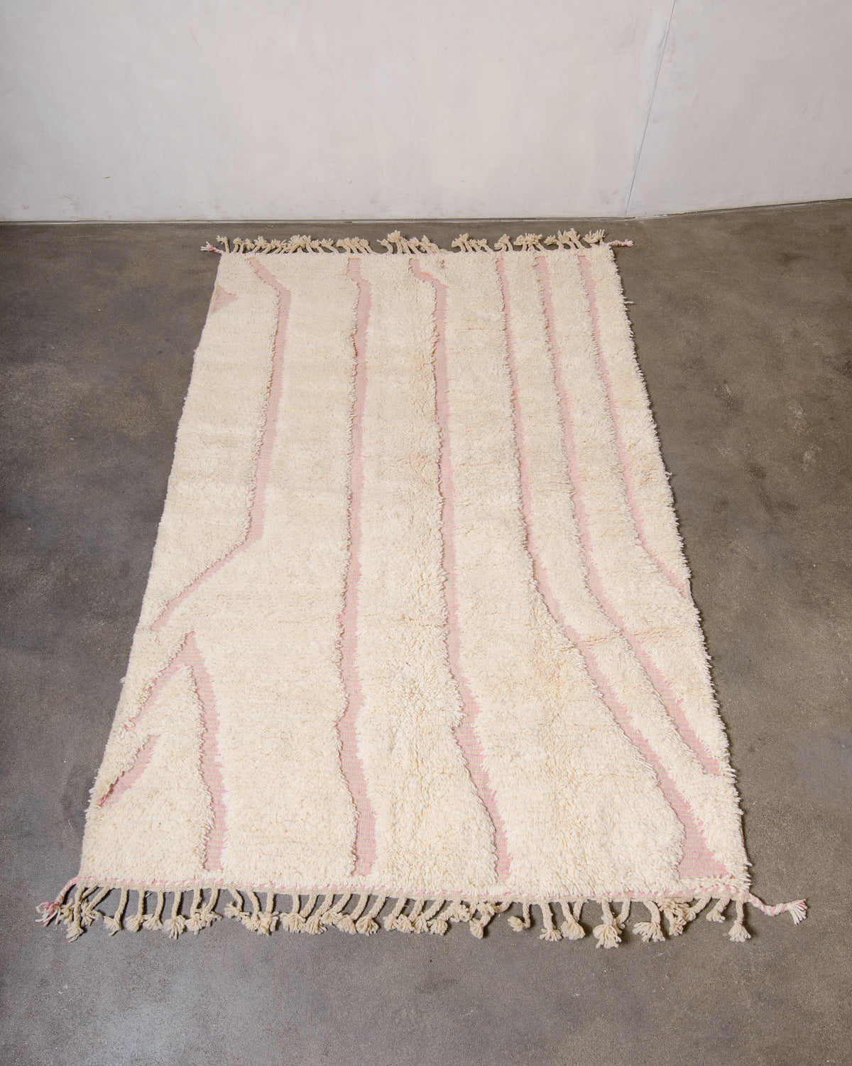 Modern, designer, handcrafted Berber rug from Morocco. Beniourain carpet with minimalist design, natural wool pile and a fluffy texture.